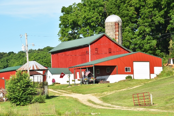 A pole barn becomes a complete structure with outdoor addons, such as the porch on this pole barn.